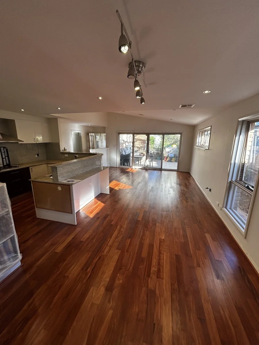 Gleaming hardwood floors in open-plan living area, timber floor sanding Shoalhaven