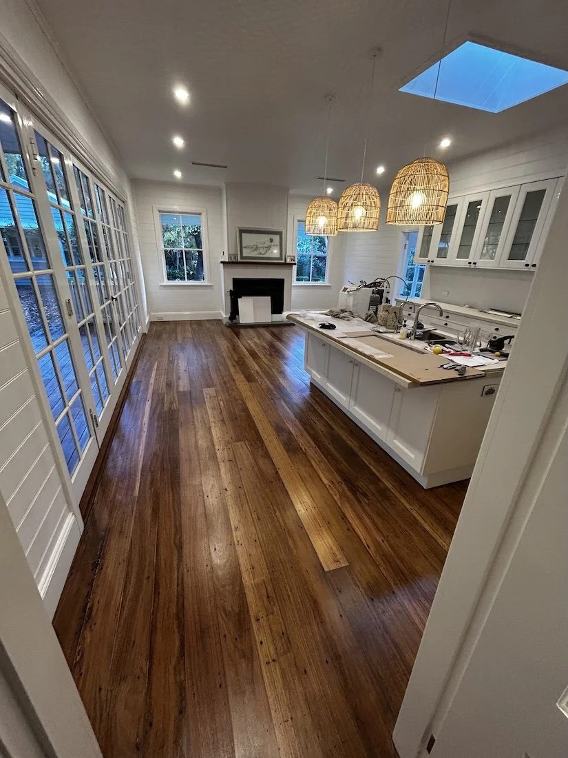 Hardwood floor installation during home renovation, flooring contractor Shoalhaven