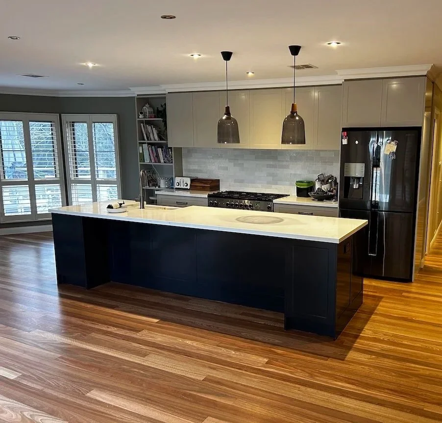 Polished hardwood timber floors in modern Shoalhaven kitchen after professional sanding