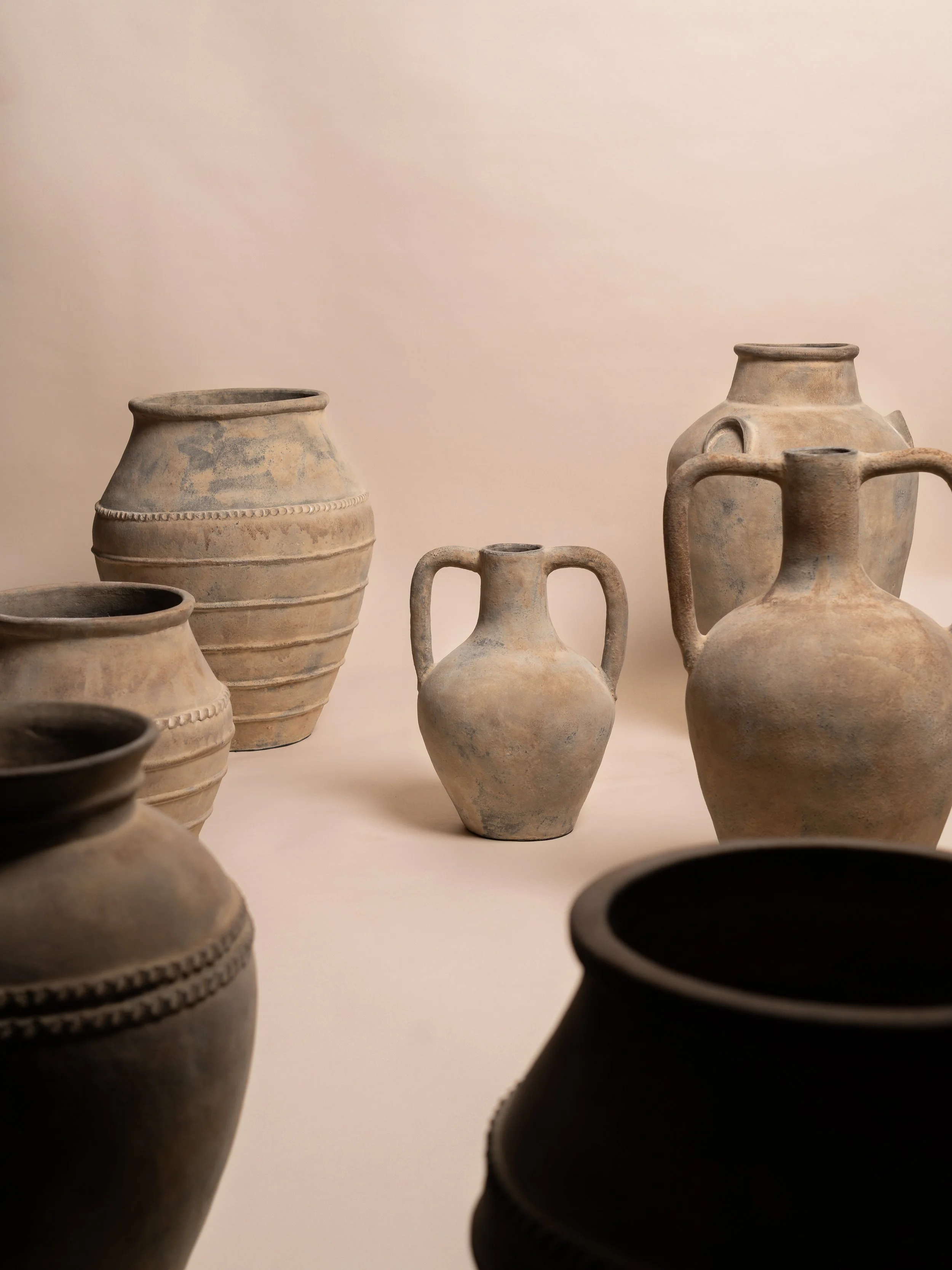 Natural Roma pot styled with the complete natural pot collection — wedding décor hire