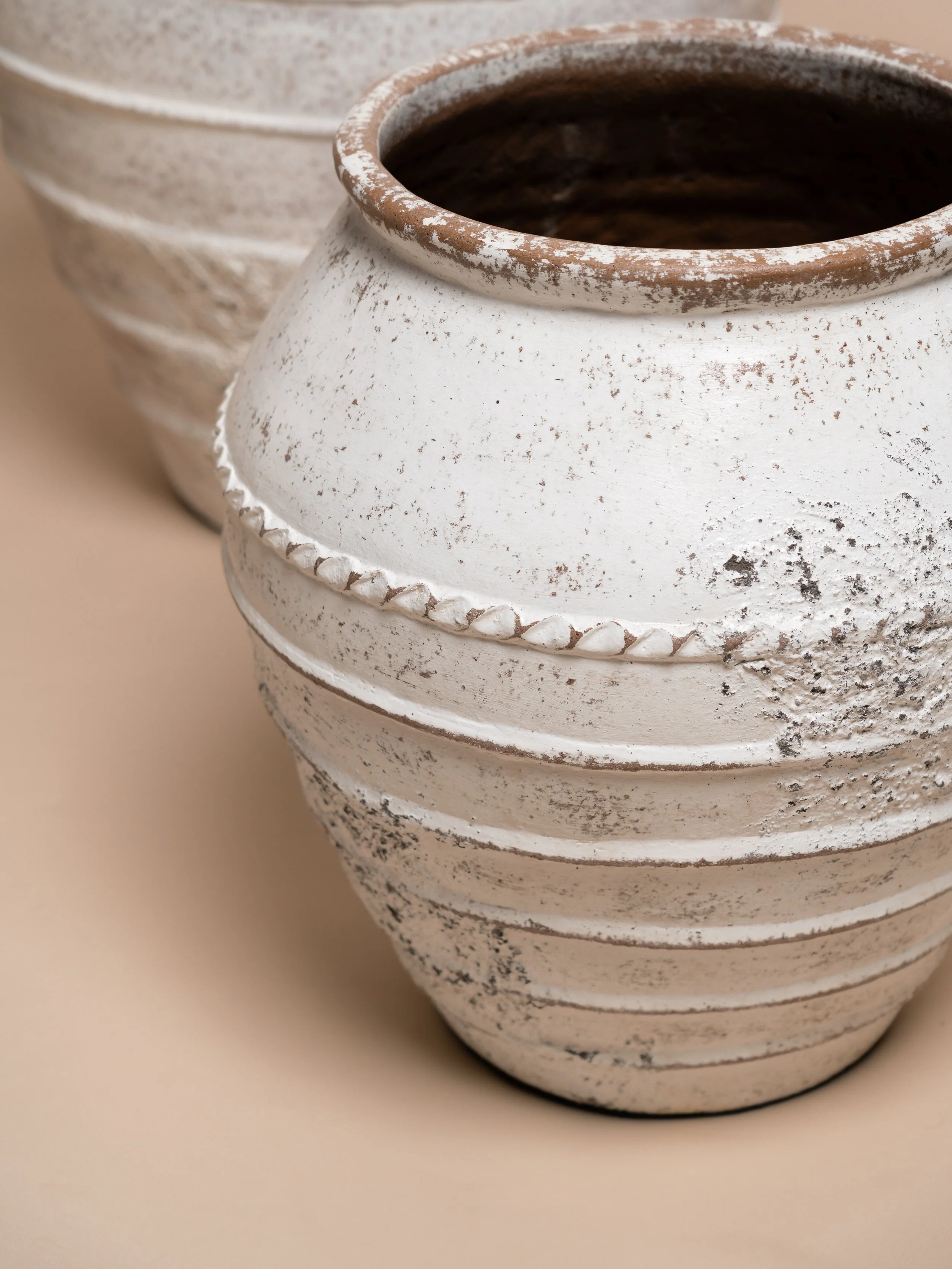 Close‑up detail of the white Amalfi pot — event décor hire