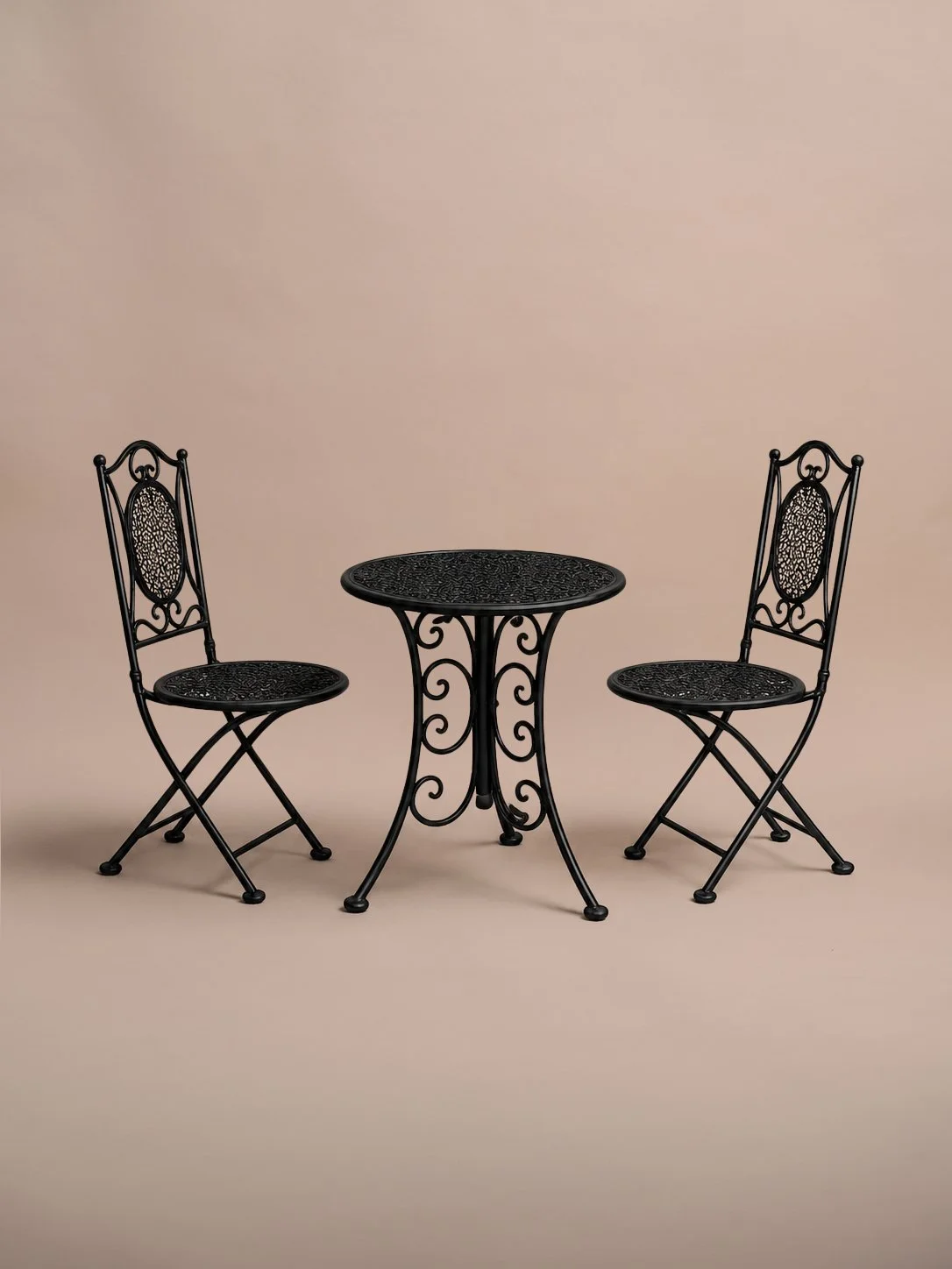 Black Eden vintage dining chairs styled with the matching garden table — outdoor wedding hire Taranaki
