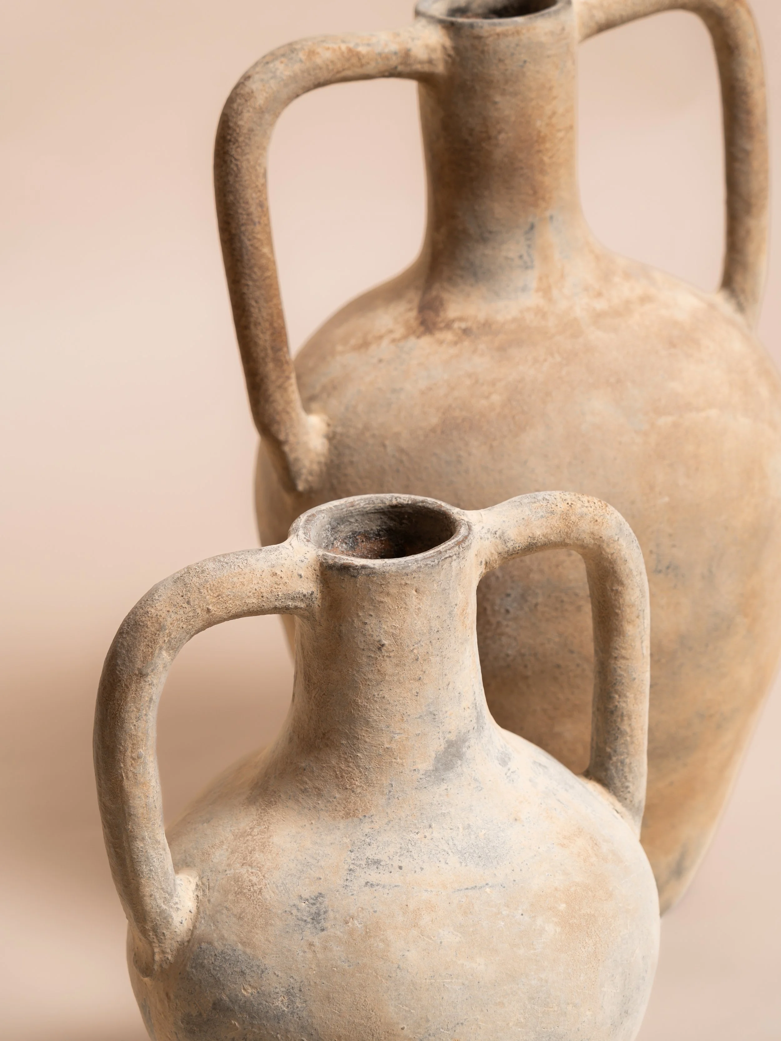 Close‑up detail of the natural Siena urn — wedding décor hire
