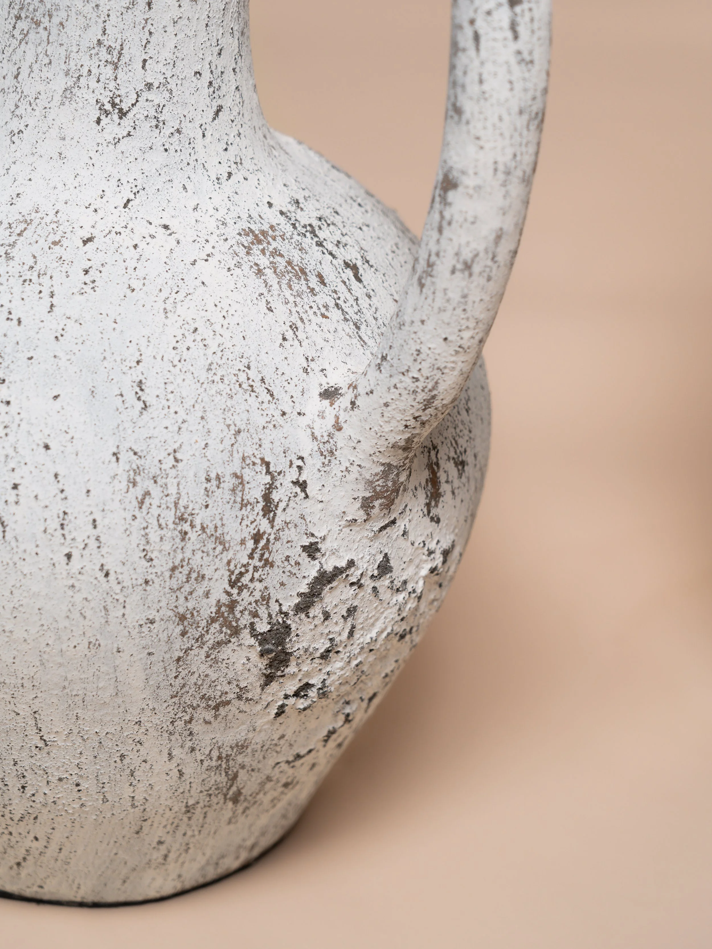Close‑up detail of the white Siena urn — wedding décor hire