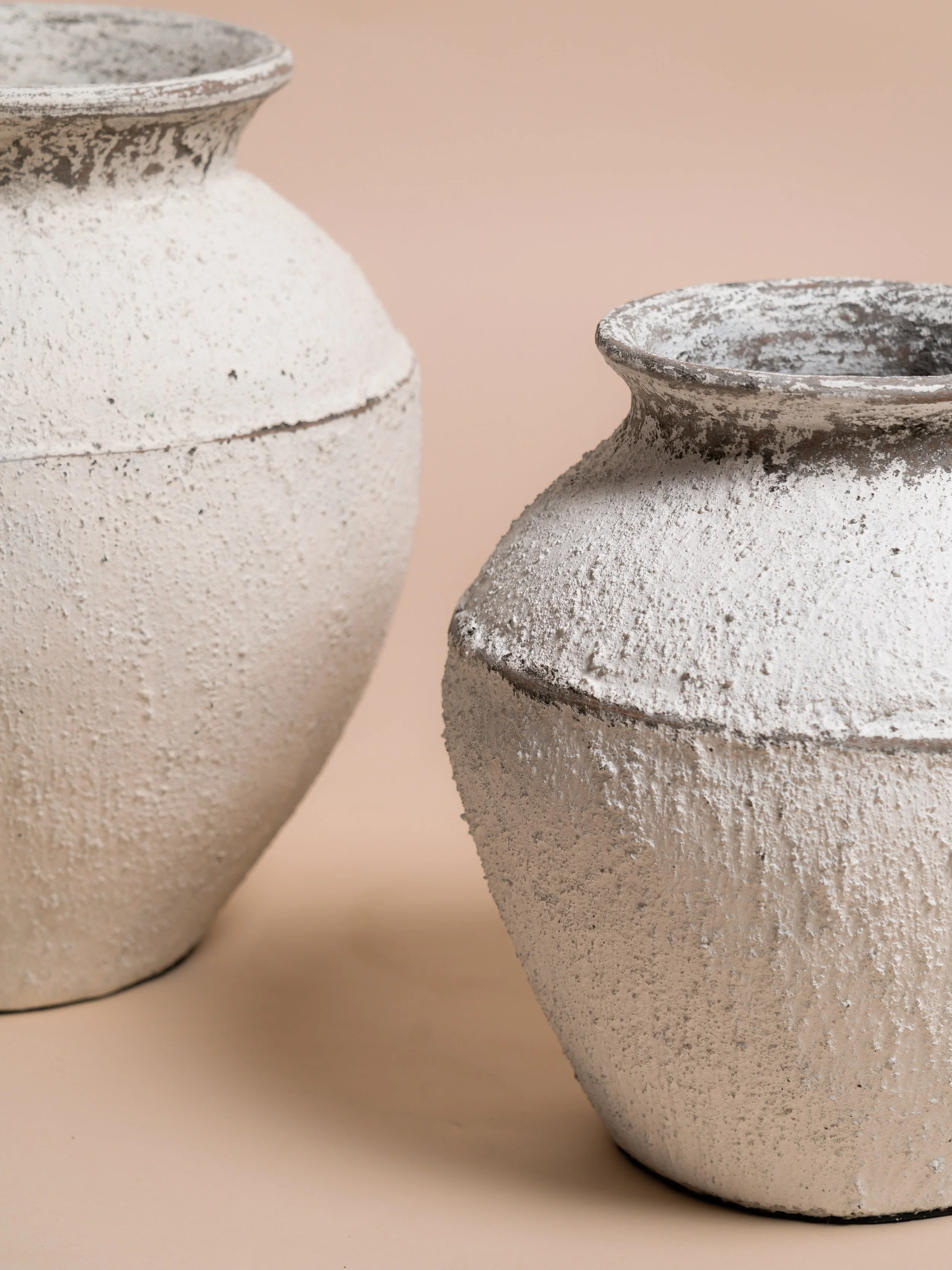 Close‑up detail of the white Capri pot — wedding décor hire