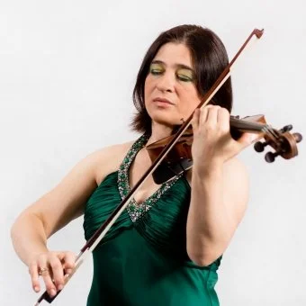 Woman in a green dress playing a violin