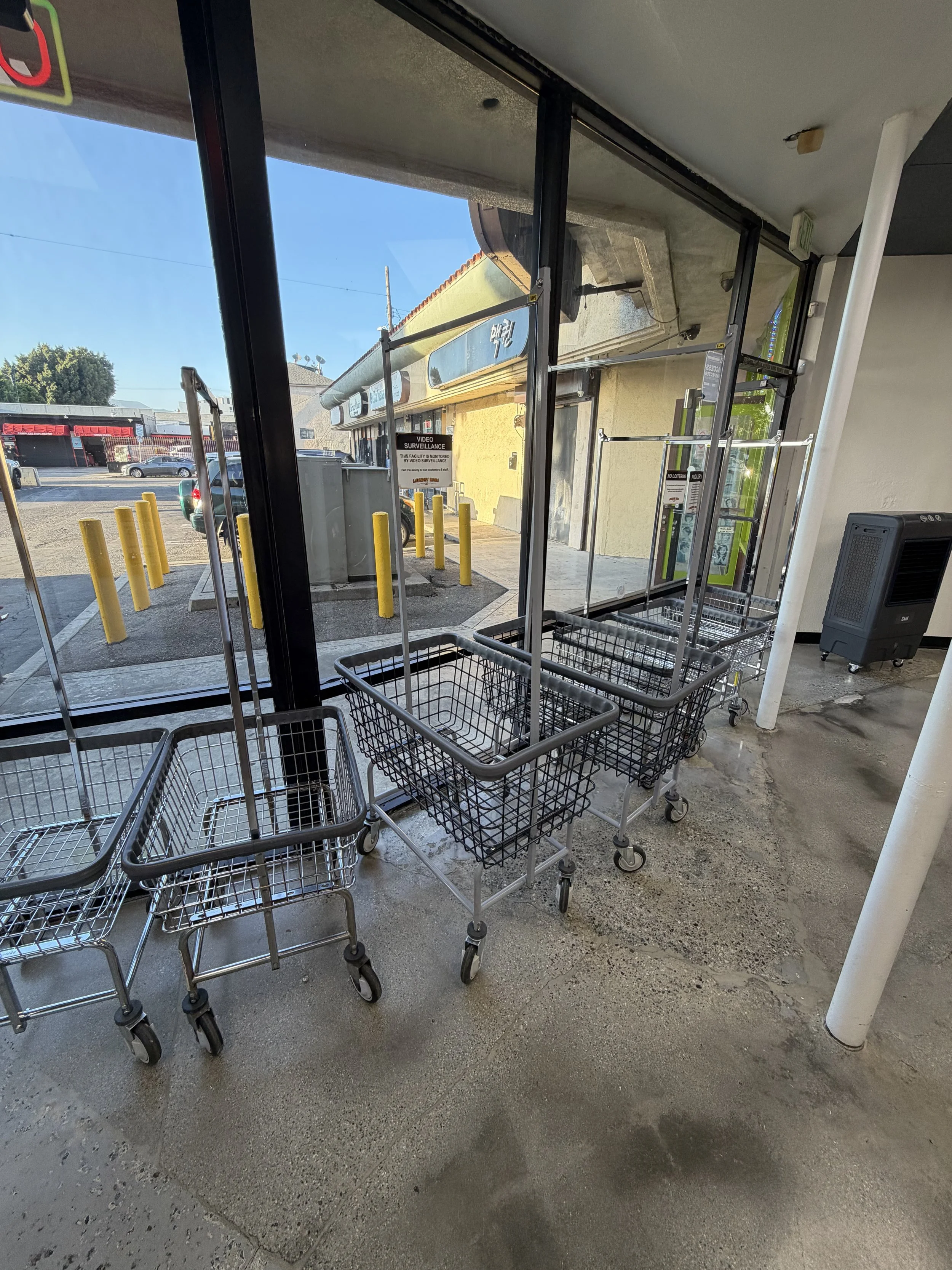 Laundry carts by the front windows at Laundry Room LA