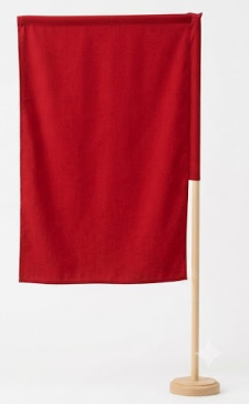 A red flag on a wooden pole with a circular base against a plain white background.