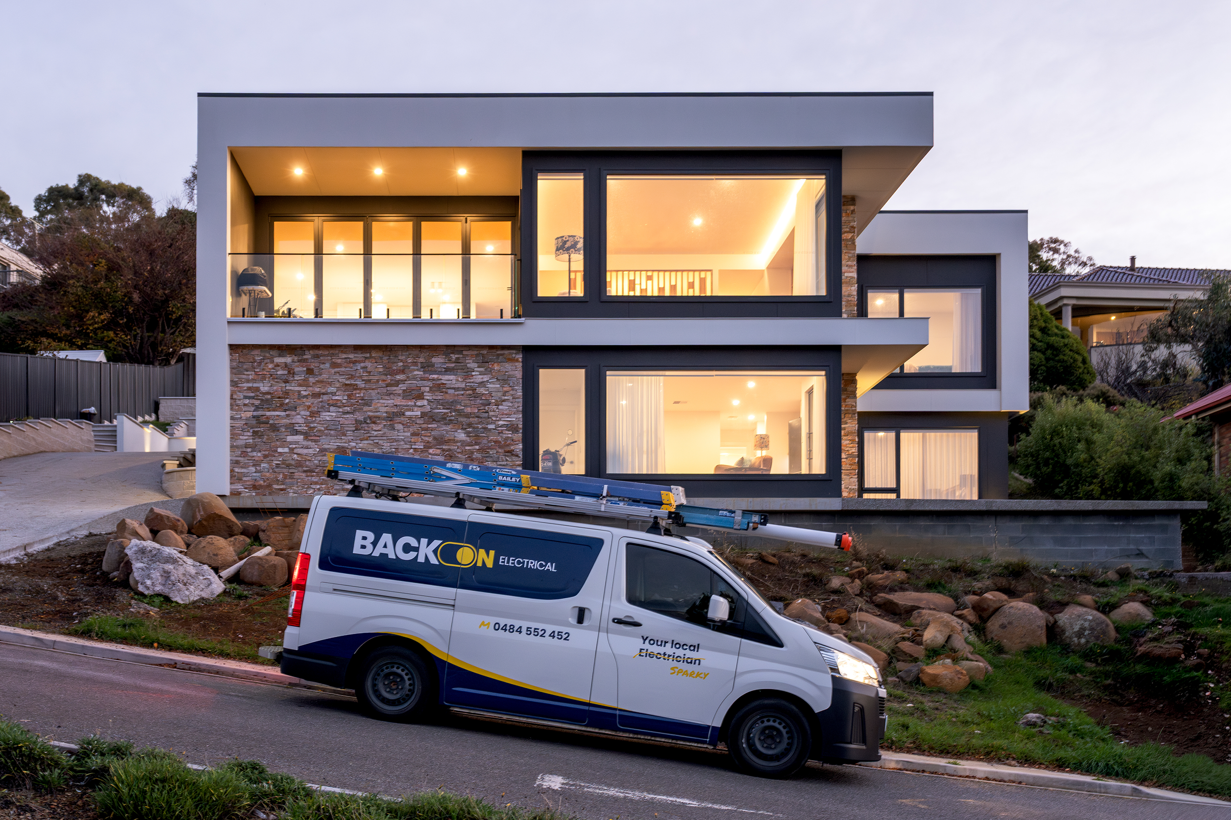 modern house with electrical lighting in tasmania with Back On Electrical van out front