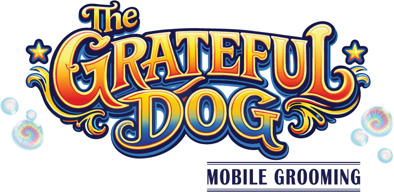 Colorful logo for 'The Grateful Dog' featuring stylized text with decorative stars and swirls on a dark background.