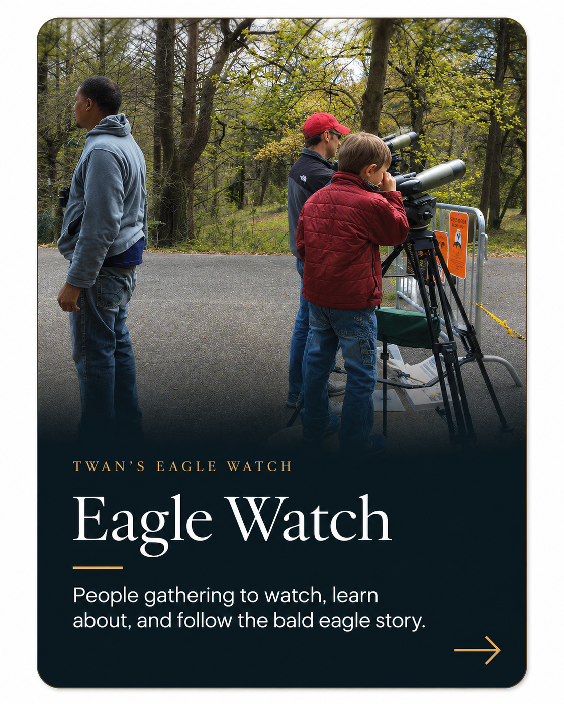 Community members using a spotting scope during an Eagle Watch observation.