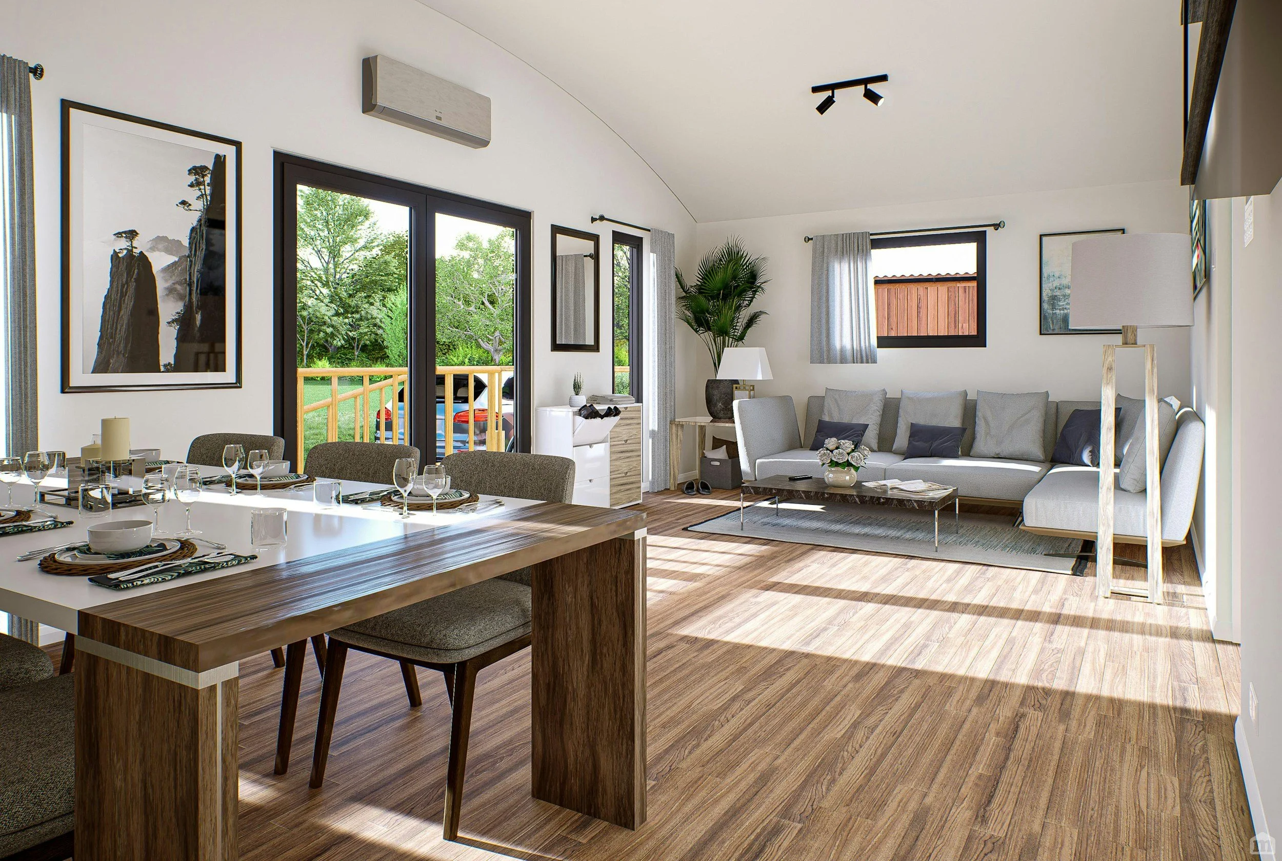 Bright living and dining room with large windows, gray couches, a wooden dining table with place settings, and decorative artwork.