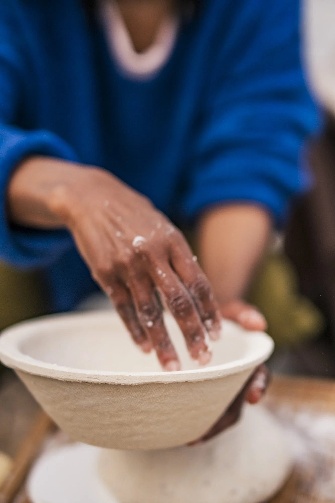 Michel Gonzaga is making the sourdough for baking a bread in her workshop