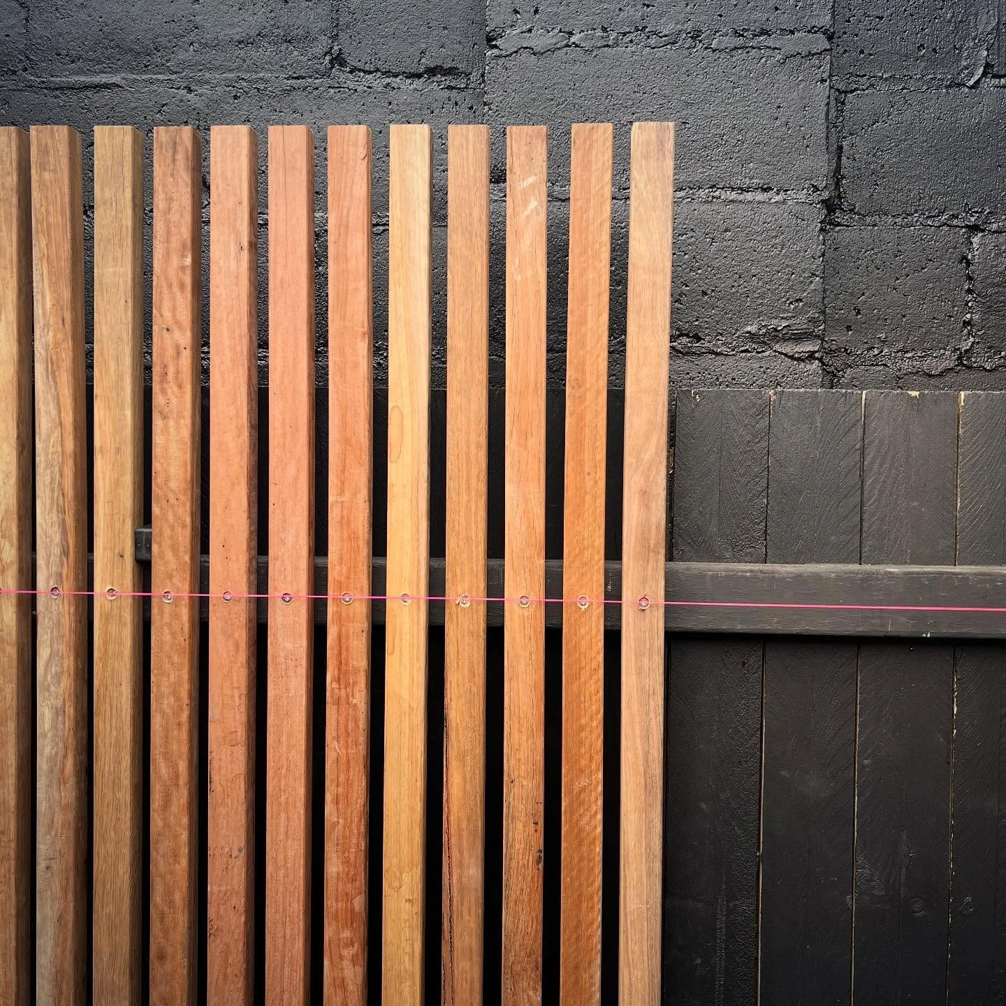 A hardwood batten back drop installed do add a more decorative finish to a fence. Batten colours hand picked when installed for nice smooth gradient of natural tones