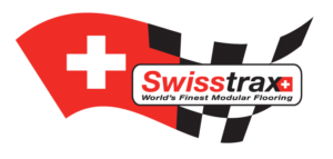 SwissTrax logo featuring a red background, a white Swiss cross, and a black-and-white checkered pattern.