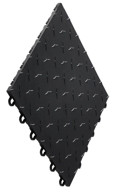A black, diamondtrax plastic tile from swisstrax