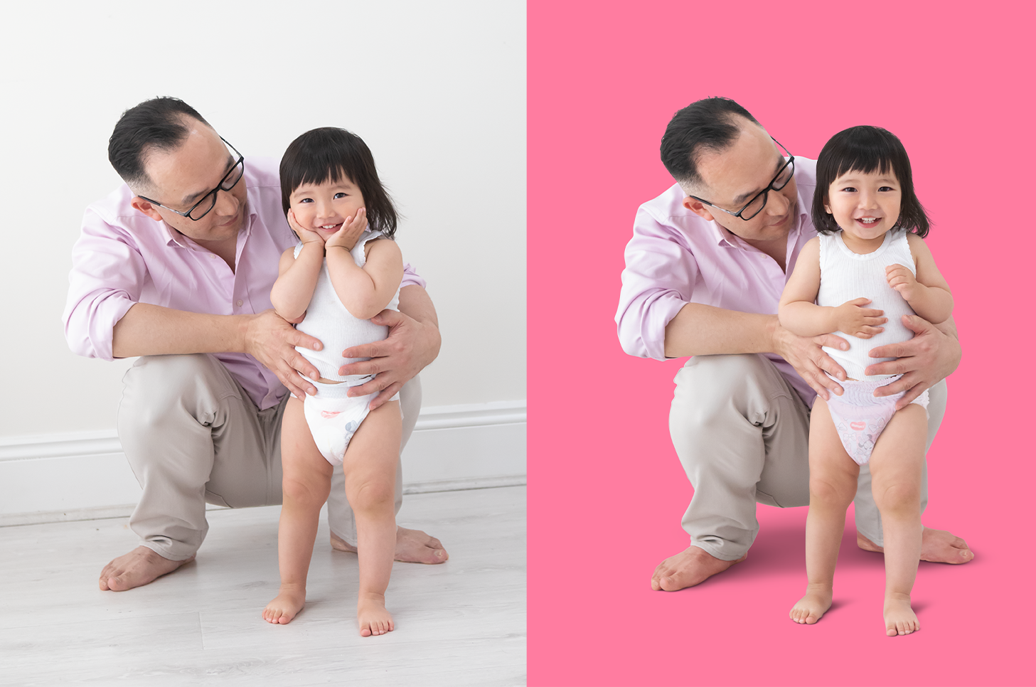 A man in glasses wearing a pink shirt and beige pants holding a smiling young girl in a white dress and diaper, with a plain white background on the left side and a pink background on the right side.