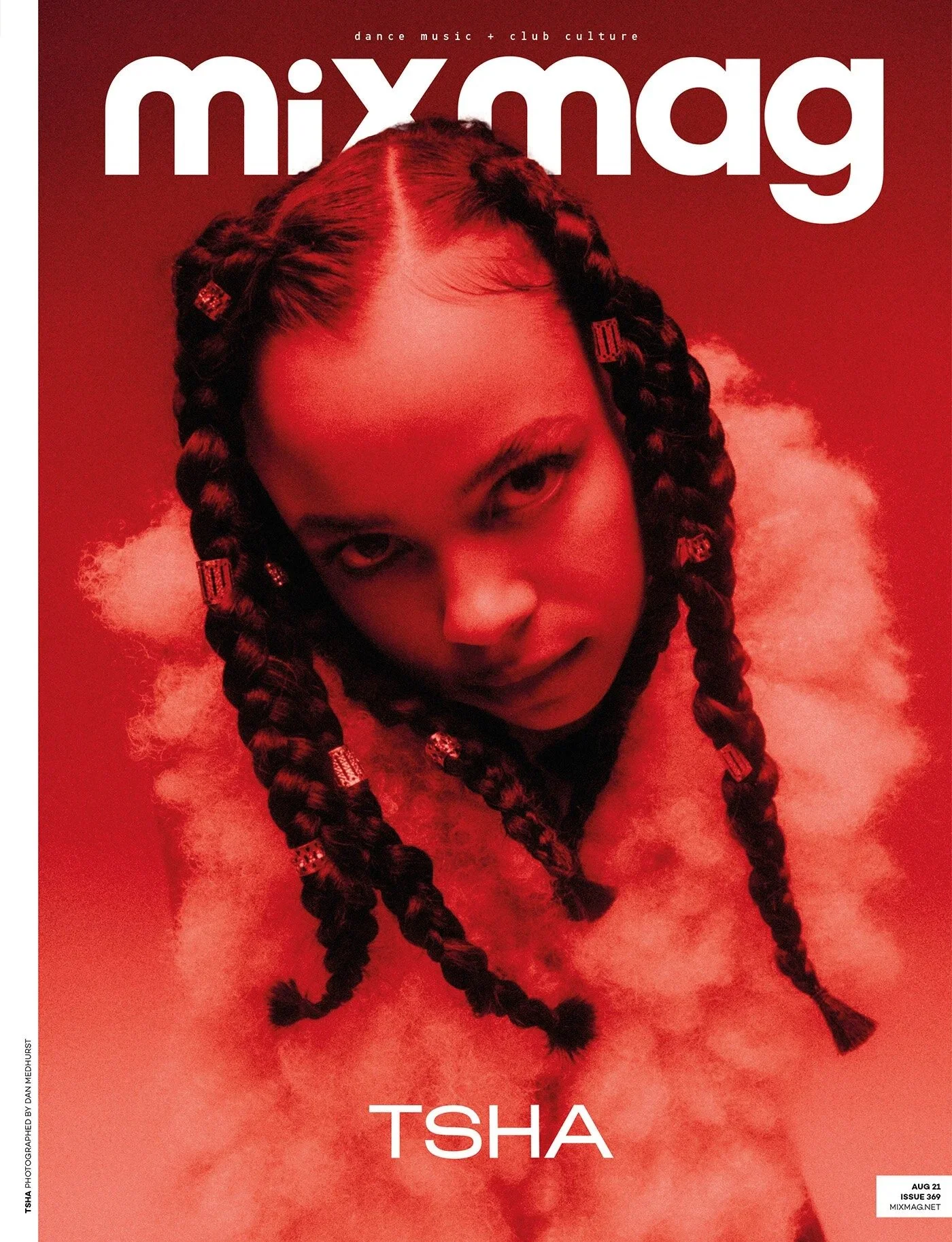 Cover of Mixmag magazine featuring a close-up portrait of rapper TSHa with braided hair, set against a red background with clouds, August 2021.