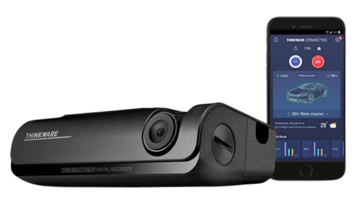A Thinkware dashcam connected to a smartphone app on the screen, showing a car's safety and parking monitor features.