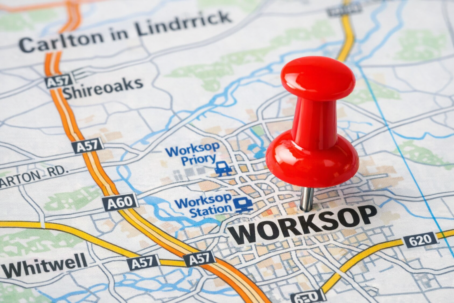 A close-up of a map with a red pushpin marking the location of Worksop in the town of Worksop, with surrounding areas and roads labeled.