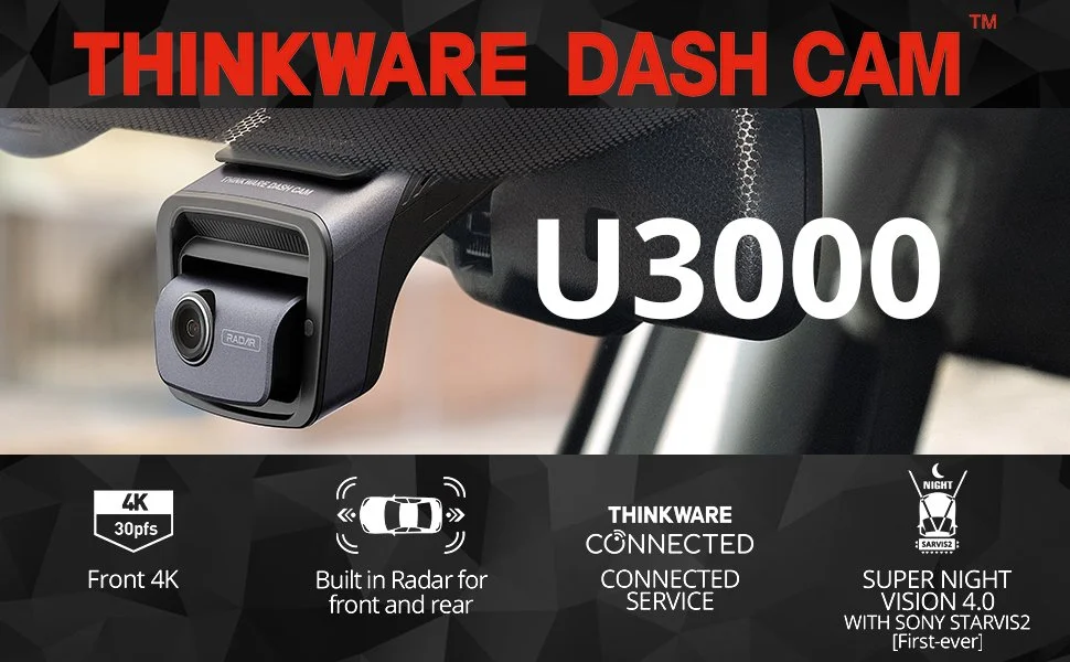 Close-up of the THINKWARE DASH CAM U3000 installed on a vehicle's windshield, with product features and branding including 4K resolution, built-in radar, and super night vision.