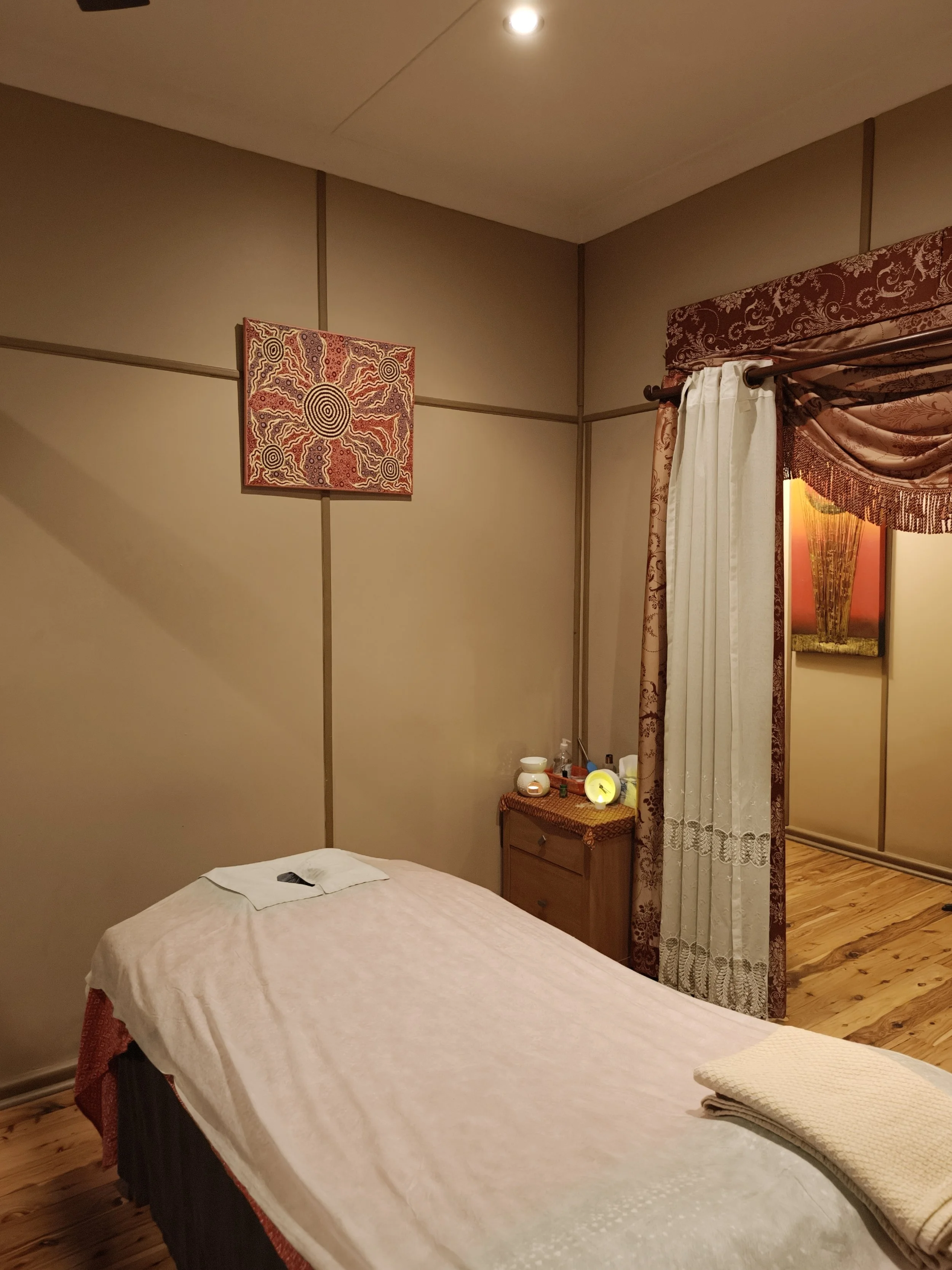 Room 4 is a smaller room with a single massage bed.