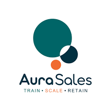 AuraSales logo featuring four overlapping circles in teal, dark blue, orange, and light blue, with the slogan "Train, Scale, Retain" underneath.