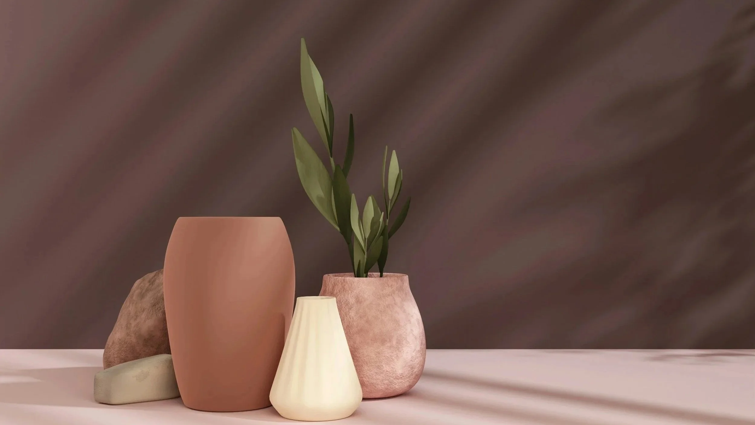 A collection of five vases on a light pink surface, with a brownish background. The vases vary in shape and color, including peach, beige, and textured pink, with one holding a green leafy plant.