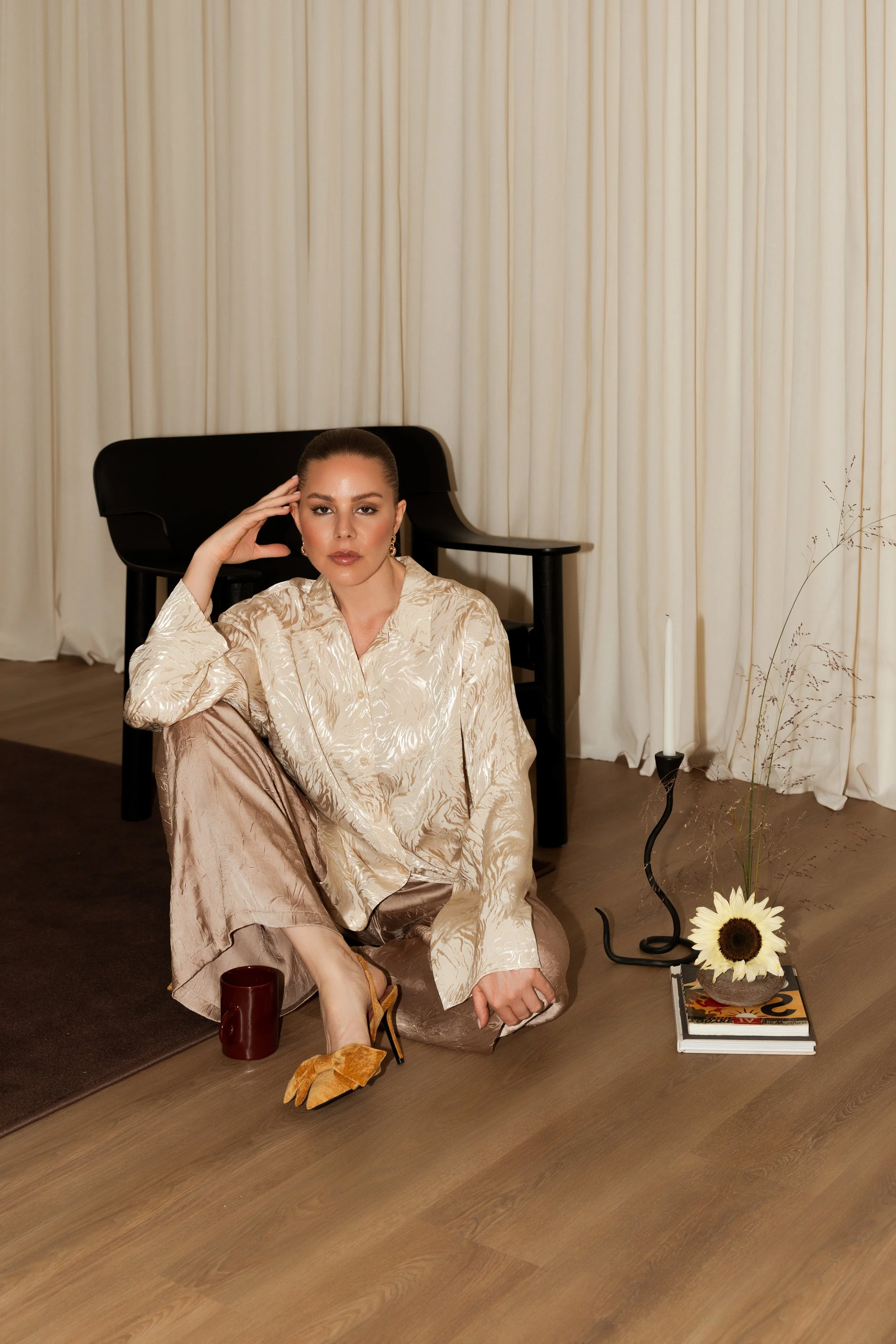 Editorial lifestyle photoshoot in Dubai featuring a woman in a beige outfit with styled props, shot by a Dubai photographer and videographer.