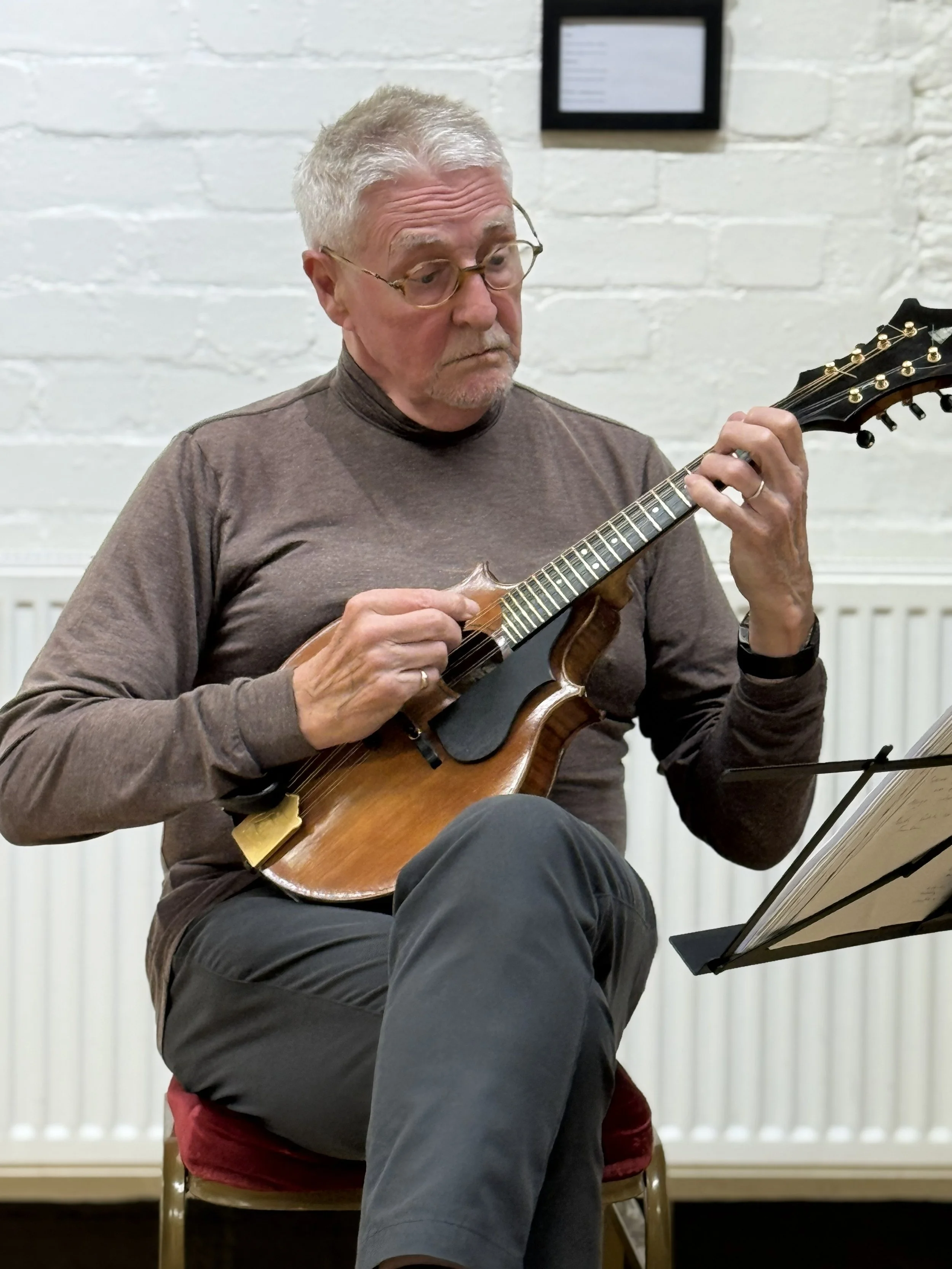 Stuart playing the mandolin