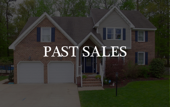Sign with the words 'Past Sales' in front of a suburban house with a brick and siding exterior, lawn, and trees in the background.