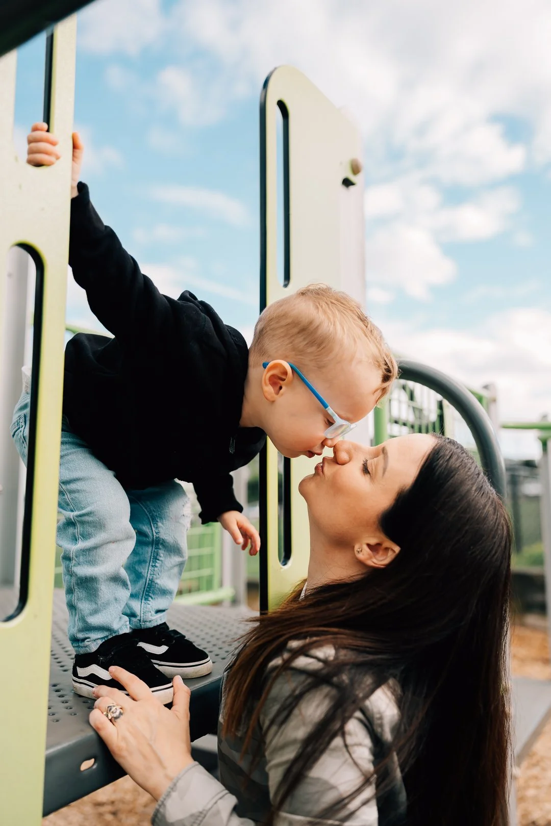 Family plays at a park for Juneau Family Photographer