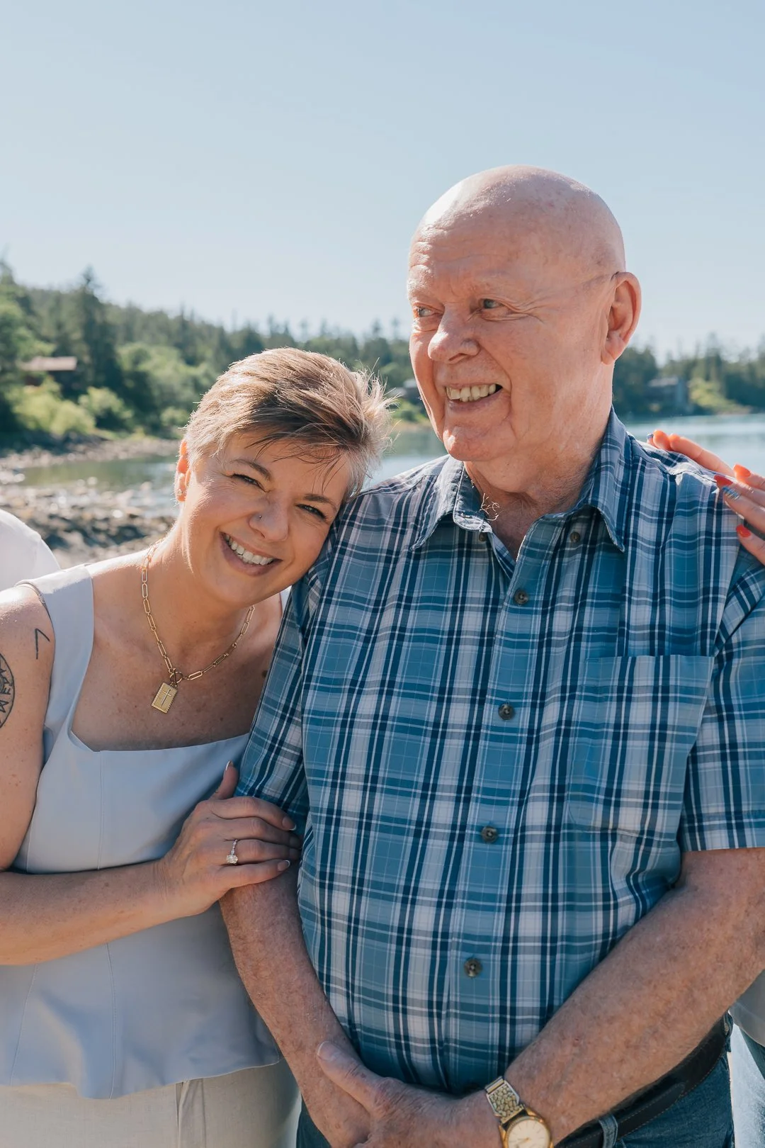 a daughter hugs her dad on a sunny day during juneau family photos