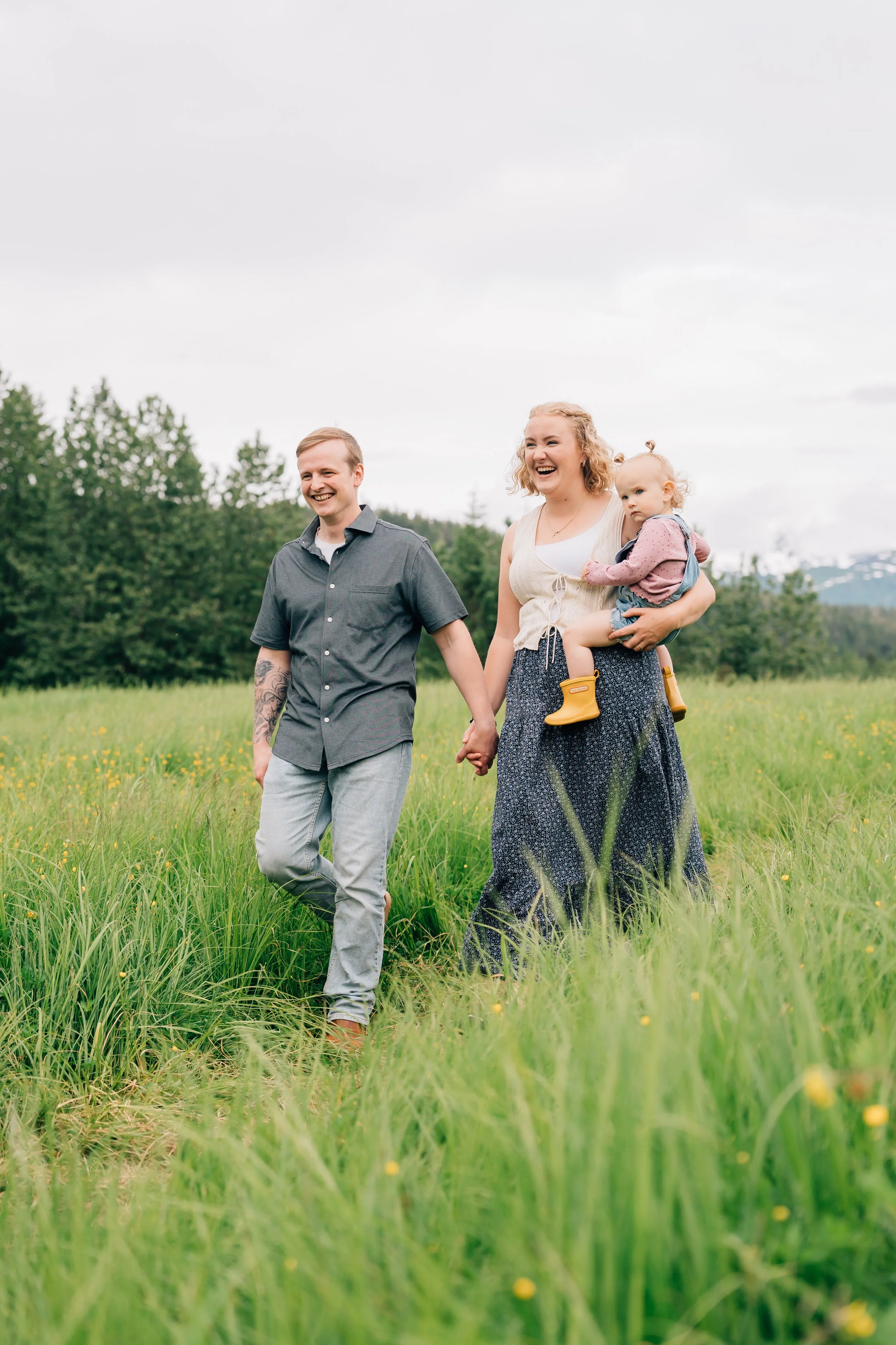 family photographer in juneau captures mom dad and baby at eagle beach