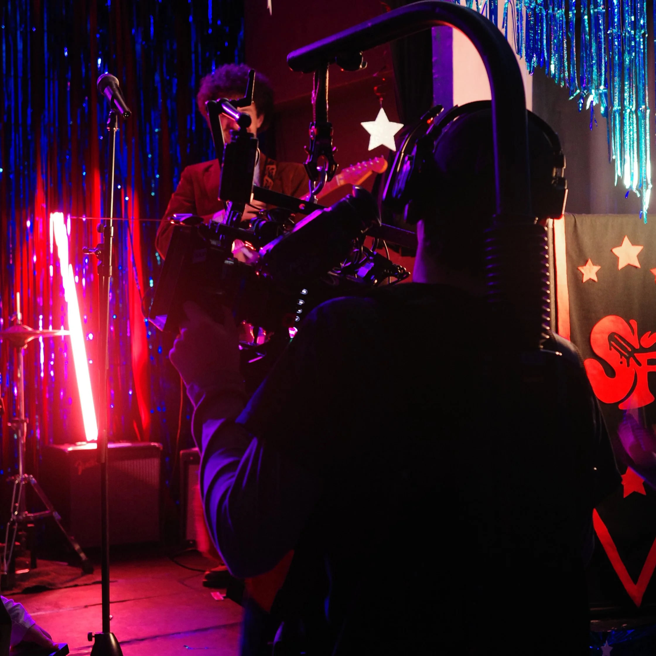 Filming the music video for Gave Me A Sign. A camera operator films a band member.