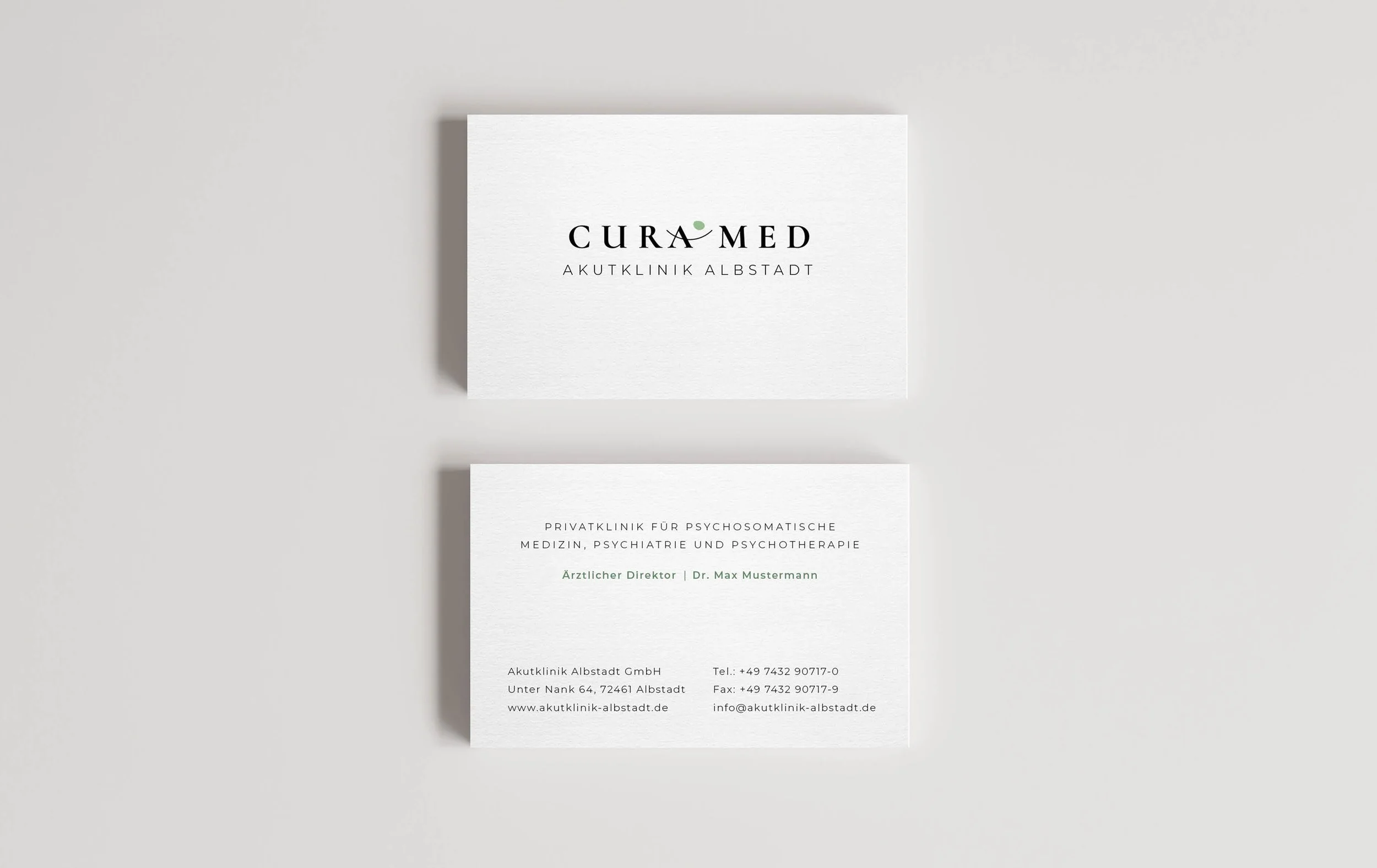Business cards for Curamed, a private clinic for psychosomatic medicine, psychiatry, and psychotherapy, showing contact information and the doctor's name, Dr. Max Mustermann.