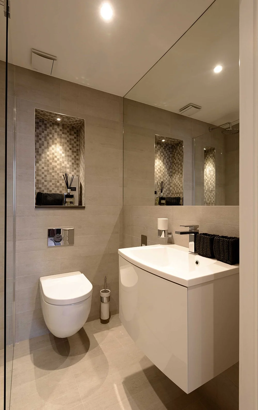 Interior photograph of a modern, compact apartment bathroom at West End Lane, London, refurbished by Nick Baker Architects.