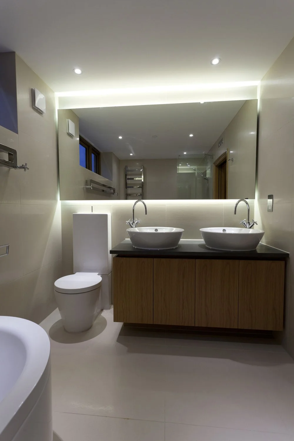 Modern interior design details by NBA showcasing a dual-sink bathroom.