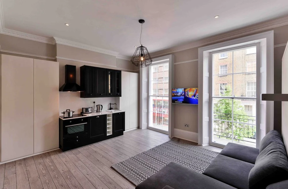 Interior photograph of a modern open-plan apartment on Gloucester Place, Central London, refurbished by Nick Baker Architects.