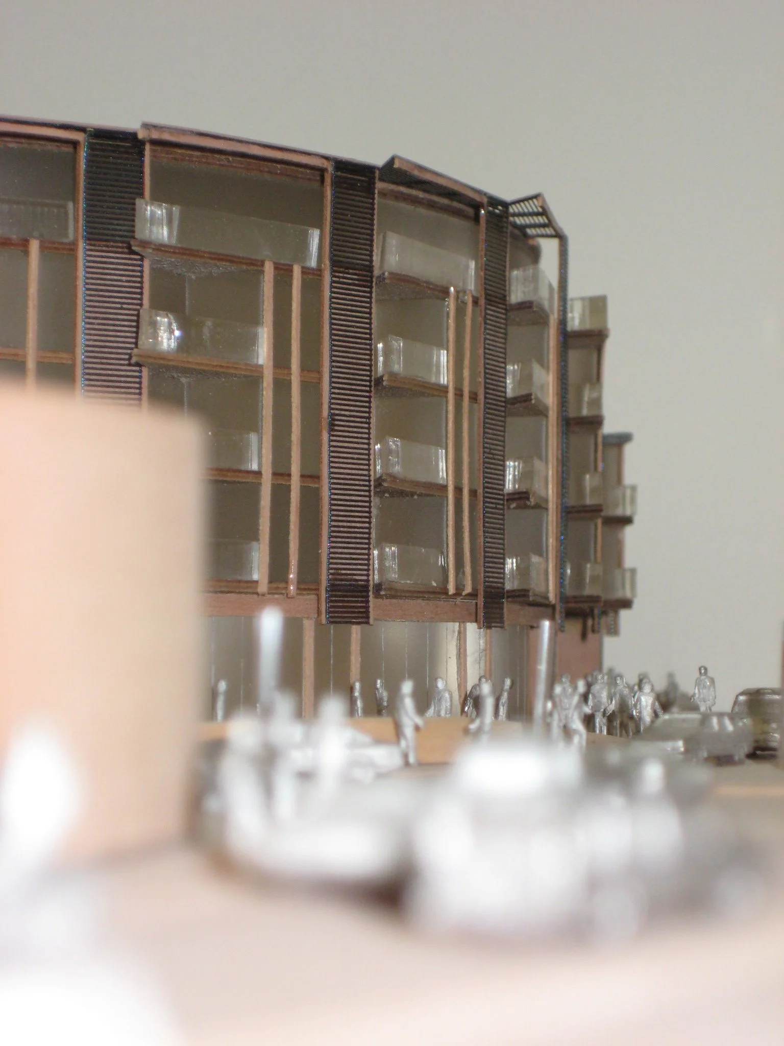 Physical scale model of a modern building facade designed by NBA, showcasing the alignment of floor plates, vertical cladding details, and balcony elements.