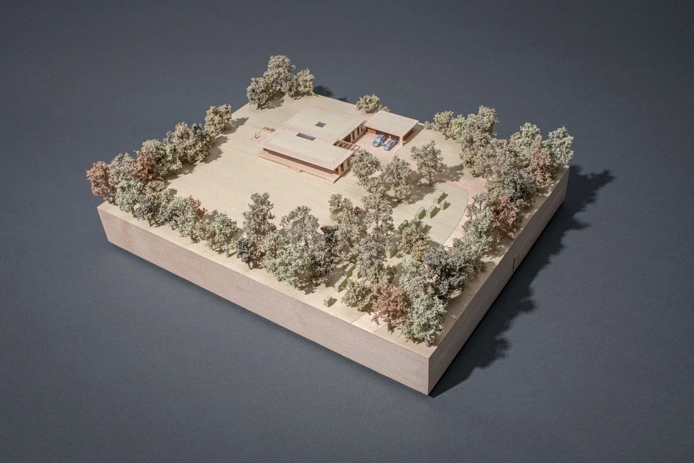 Physical architectural massing model demonstrating the site plan, central entrance courtyard layout, and spatial relationship between the primary residential pavilions.