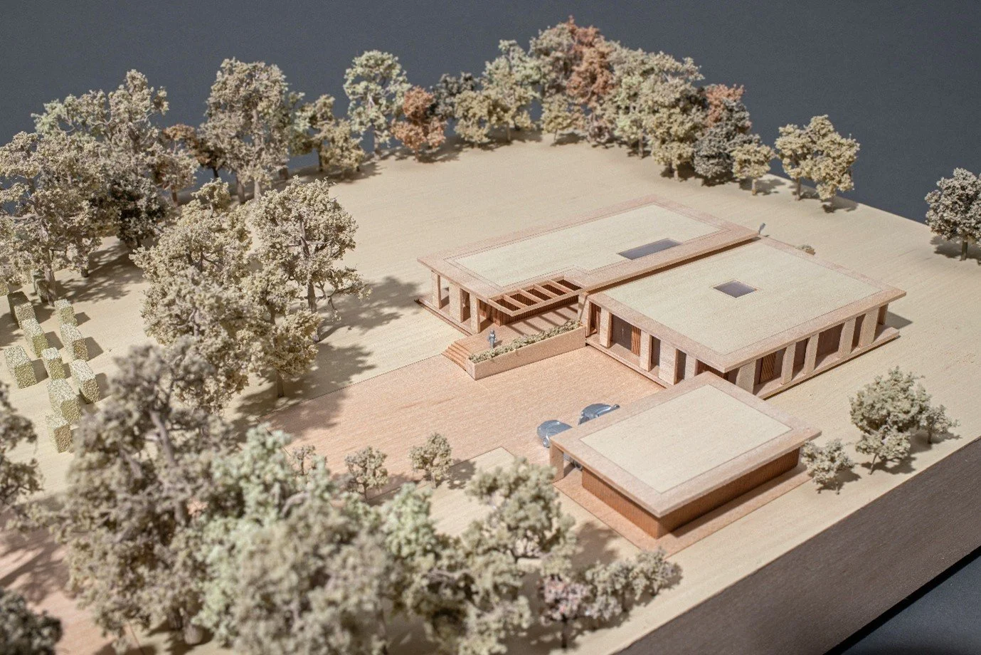 Physical architectural massing model demonstrating the site plan, central entrance courtyard layout, and spatial relationship between the primary residential pavilions.