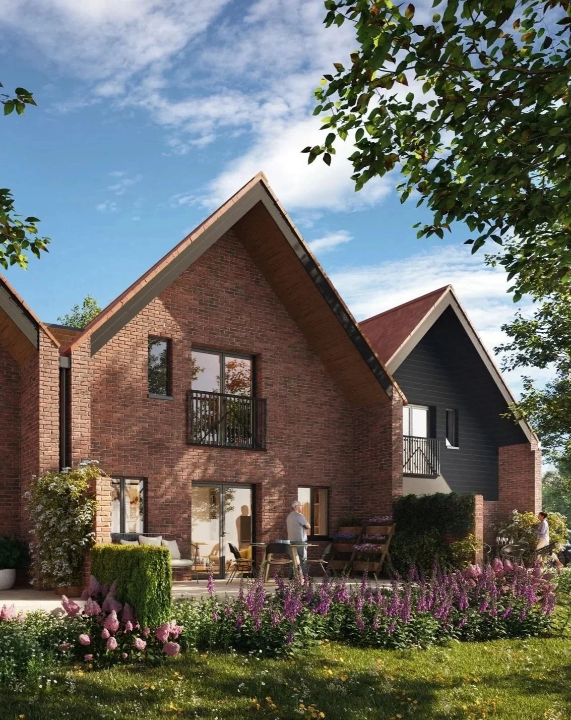 View along the main access road at Shiplake Meadows showcasing the completed contemporary cottages and apartment blocks.