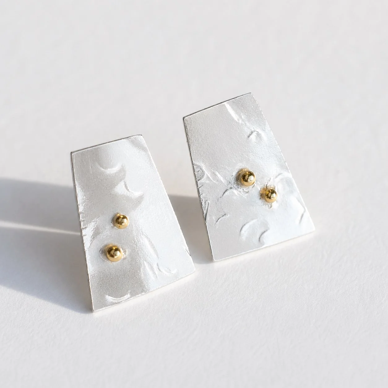 Polished silver/18ct gold detail earrings