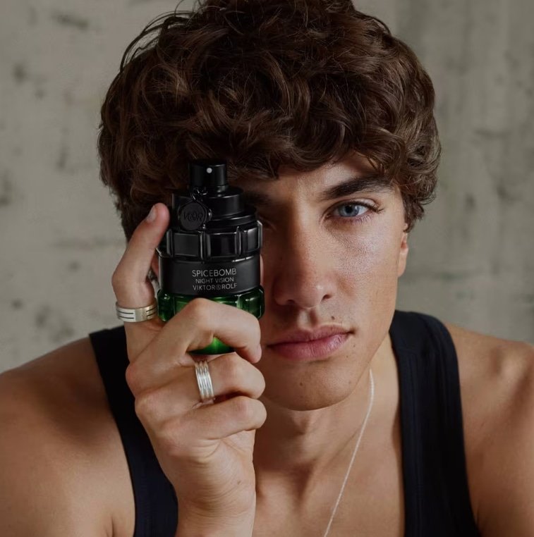 Model displaying niche fragrance Spicebomb Night Vision EDT 3oz spray for men by Viktor&Rolf, fresh spicy designer cologne.