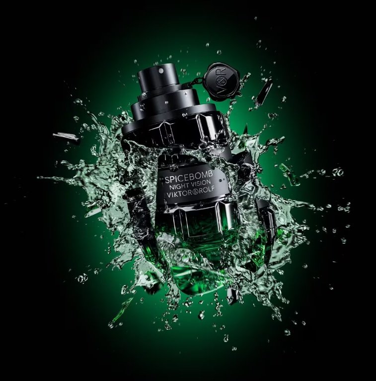 Close-up of Viktor&Rolf Spicebomb Night Vision 3 oz EDT men's fragrance in green grenade bottle, splashed into a black background.