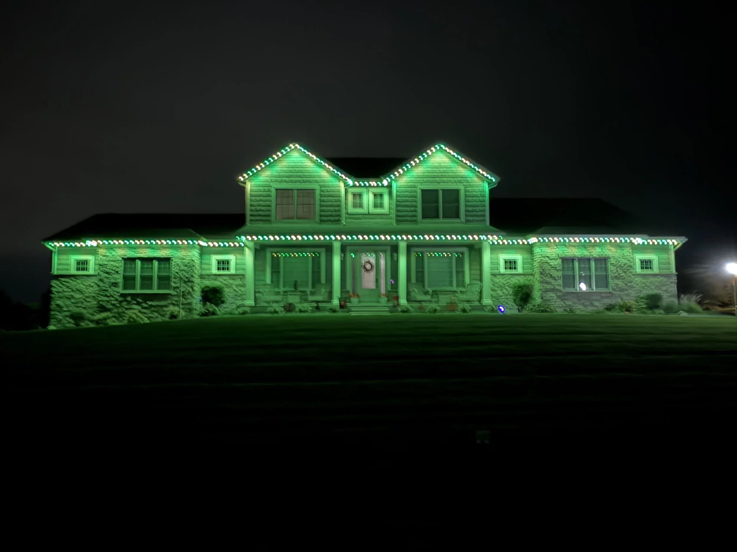 A house decorated with LED permanent lights at night.