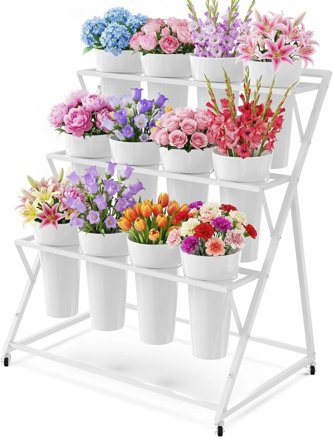 Assorted colorful flowers in white pots on a white multi-tiered flower stand.