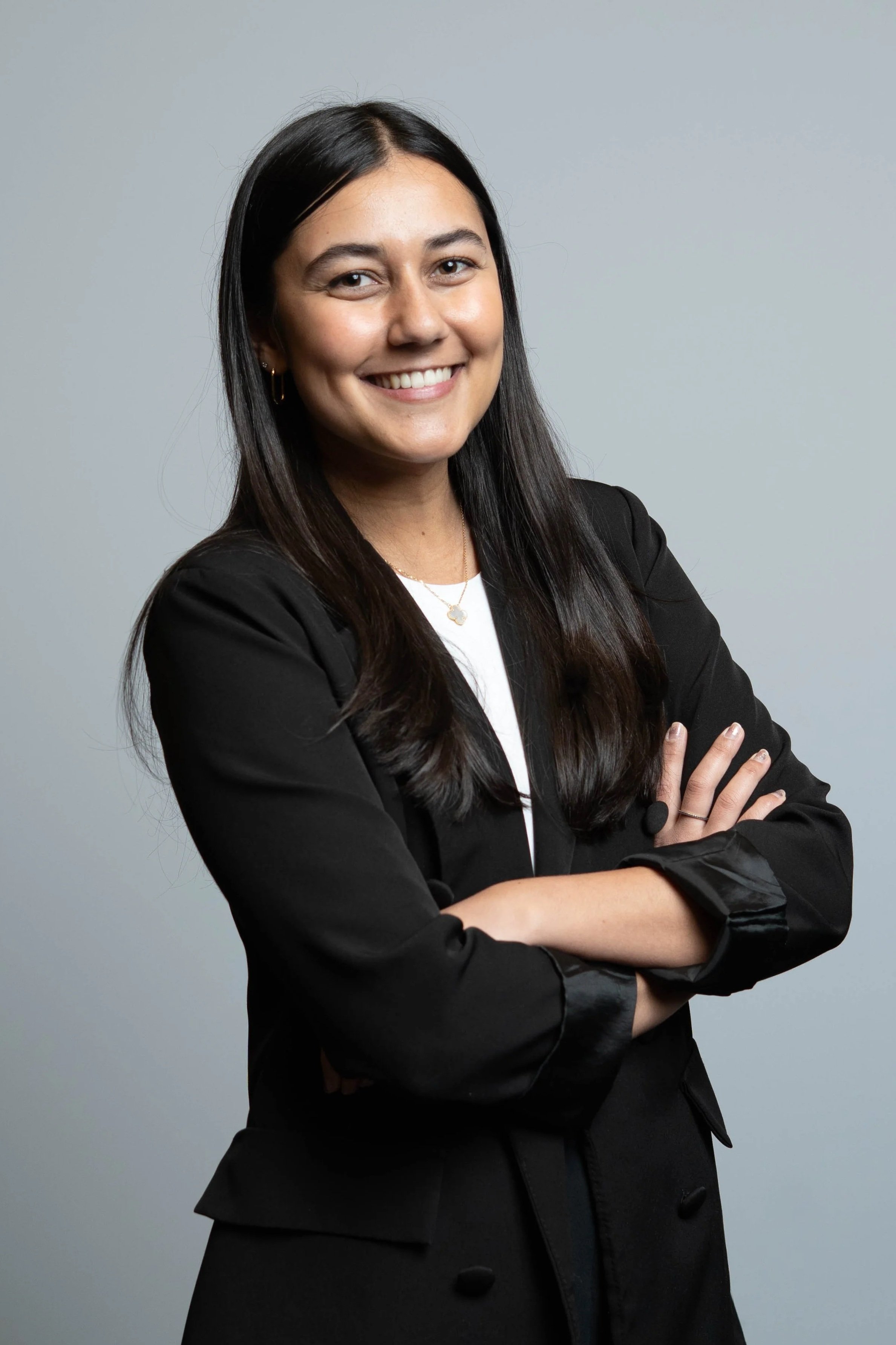 Professional woman posing confidently during a corporate headshot experience with Framed in Color Photo Booth for business events and conferences.