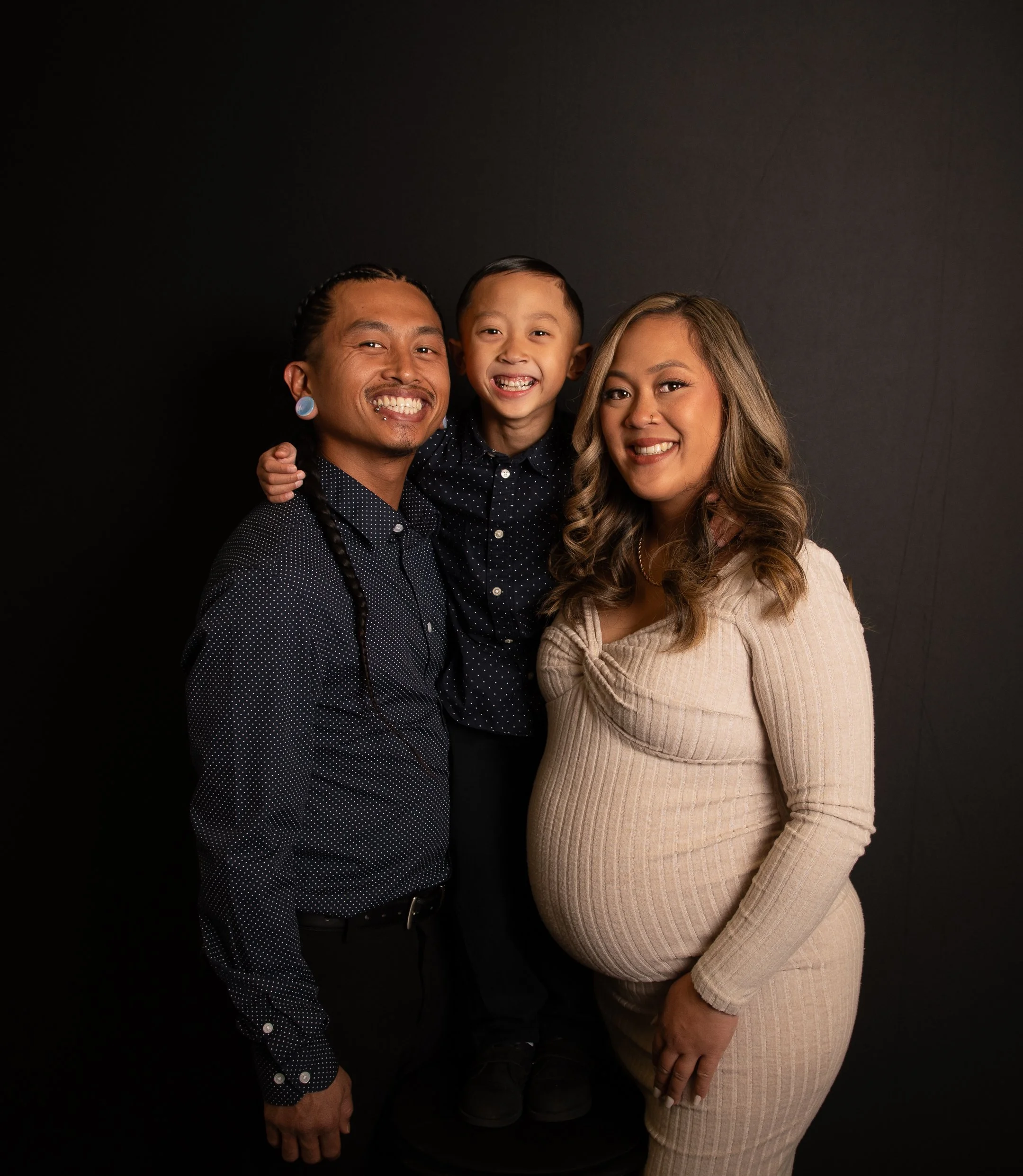 Smiling family creating lasting memories with a premium photo booth experience during a baby shower celebration.